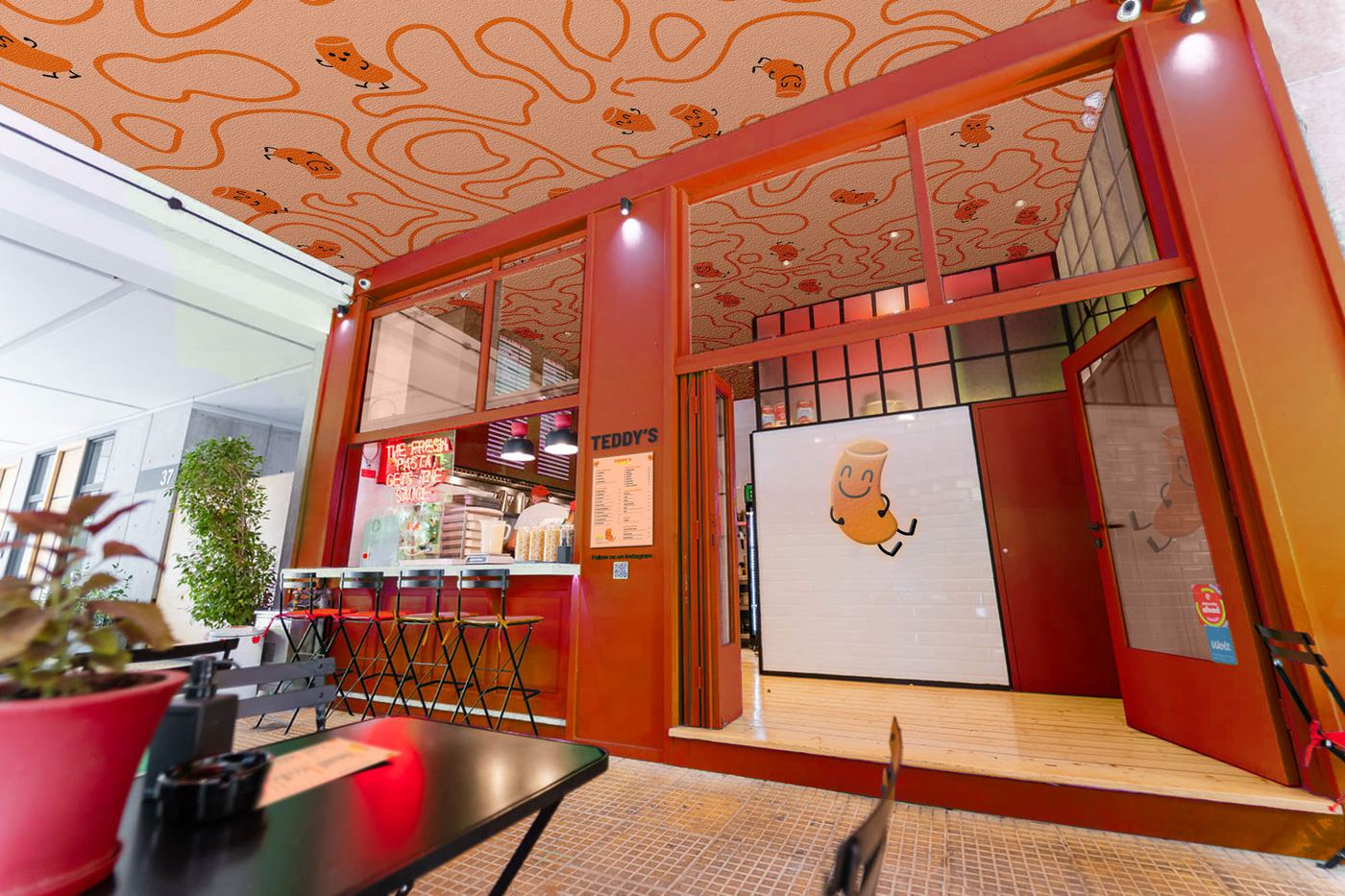 The Teddy's storefront concept with orange frame, squiggle ceiling and counter seating